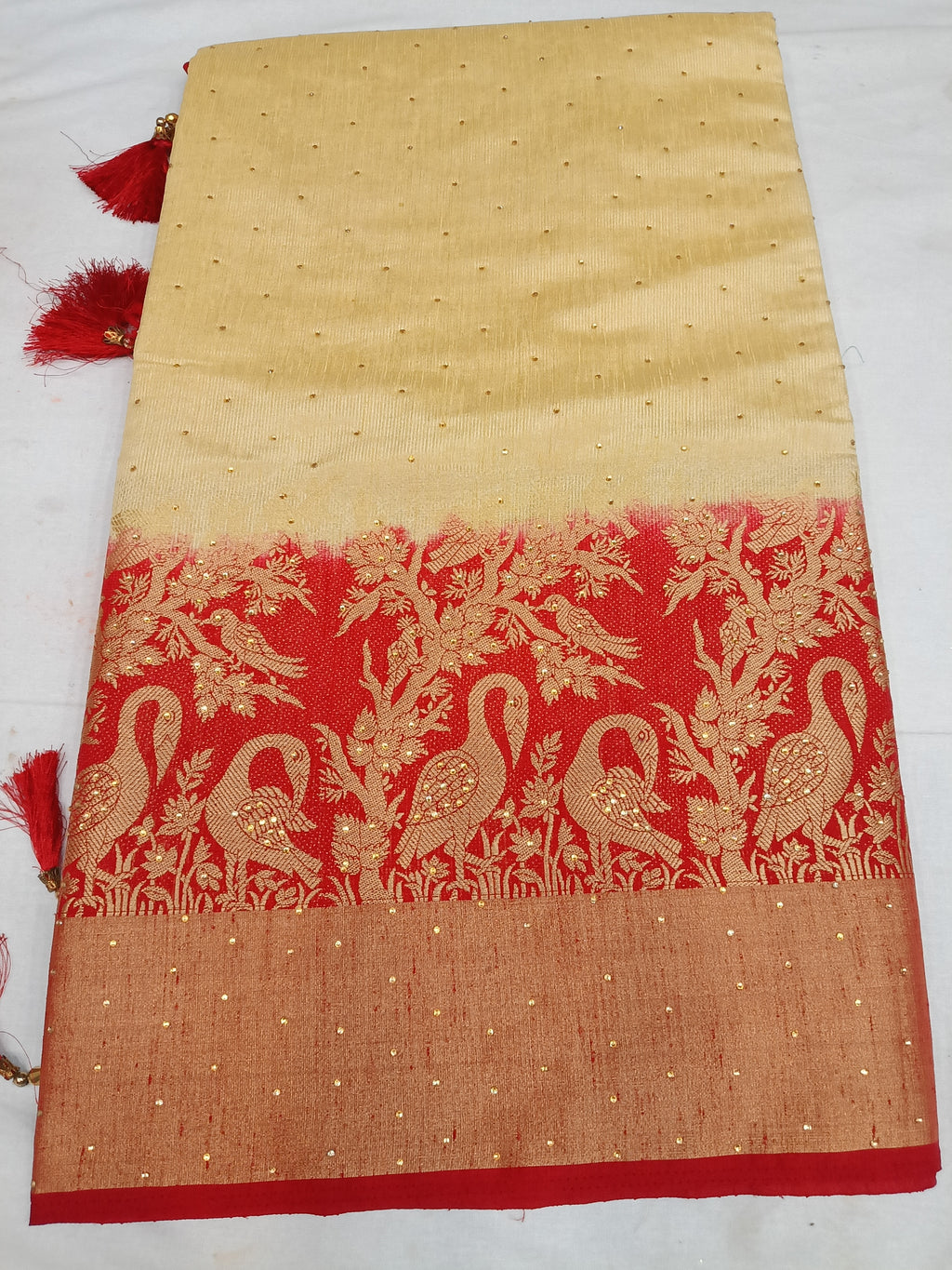 Off white cream and red color saree with stone work