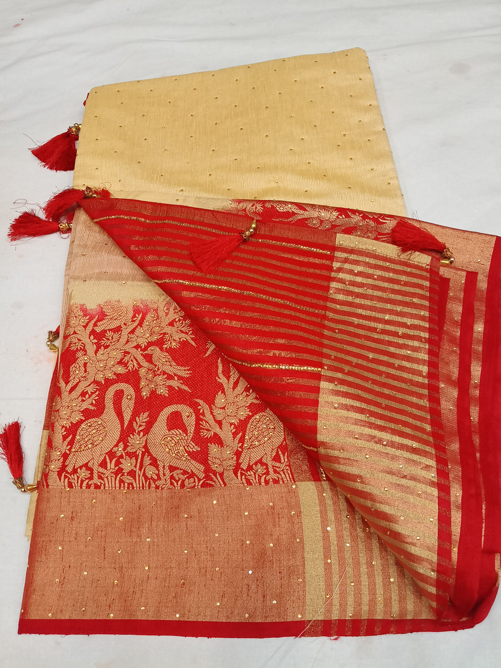 Off white cream and red color saree with stone work