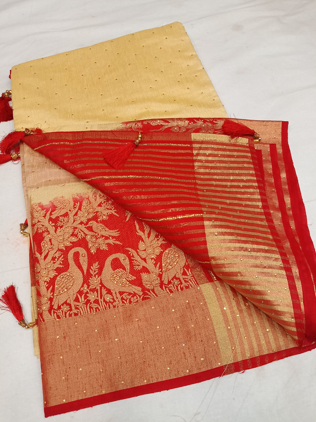 Off white cream and red color saree with stone work